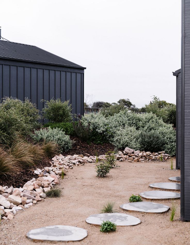 Sandstone dust paved area beside beautifully landscaped cabins — Burrum Landscape Supplies Howard QLD