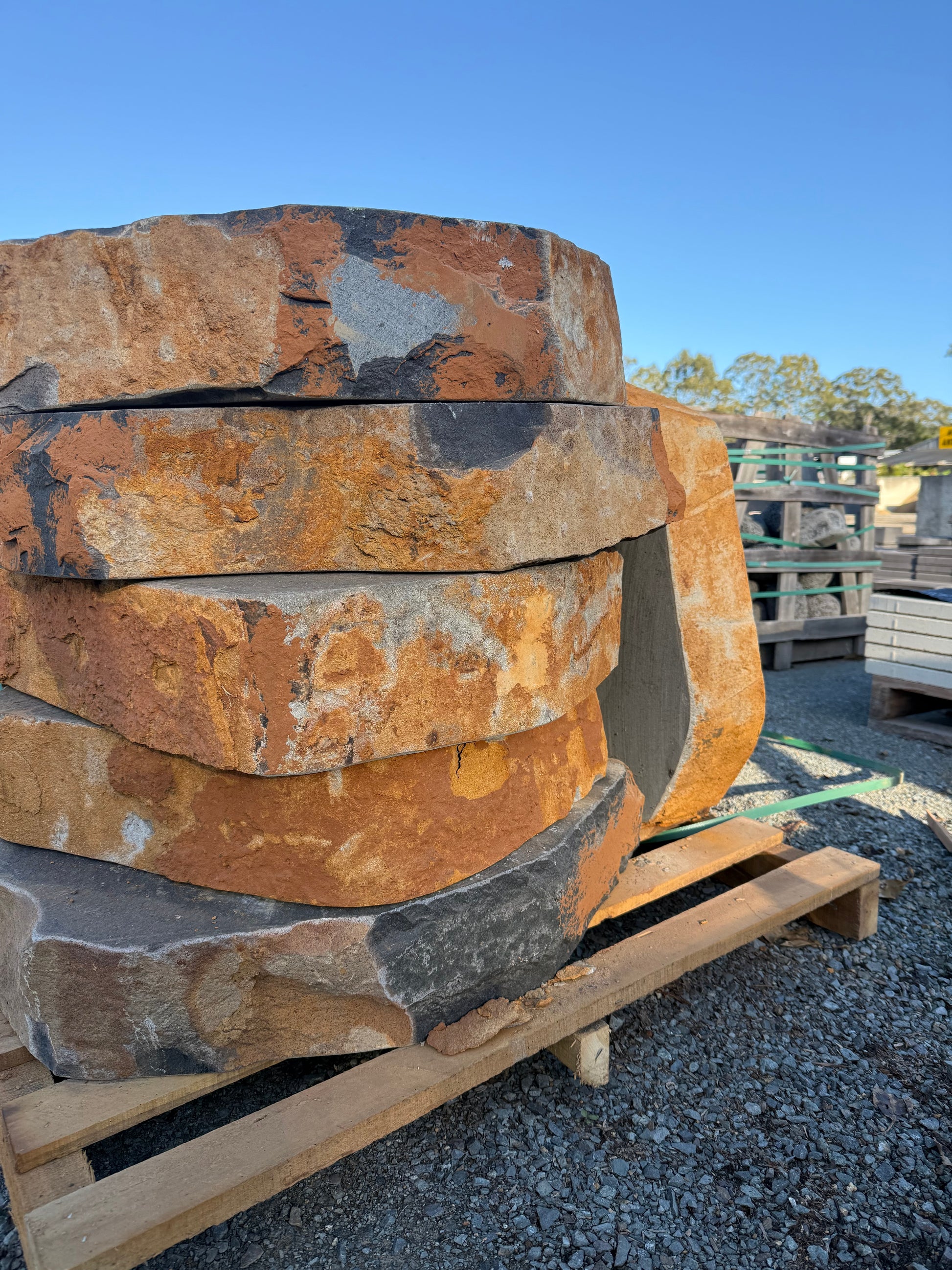 Close-up of basalt flamed step surface and brown natural edge — Burrum Landscape Supplies Howard QLD