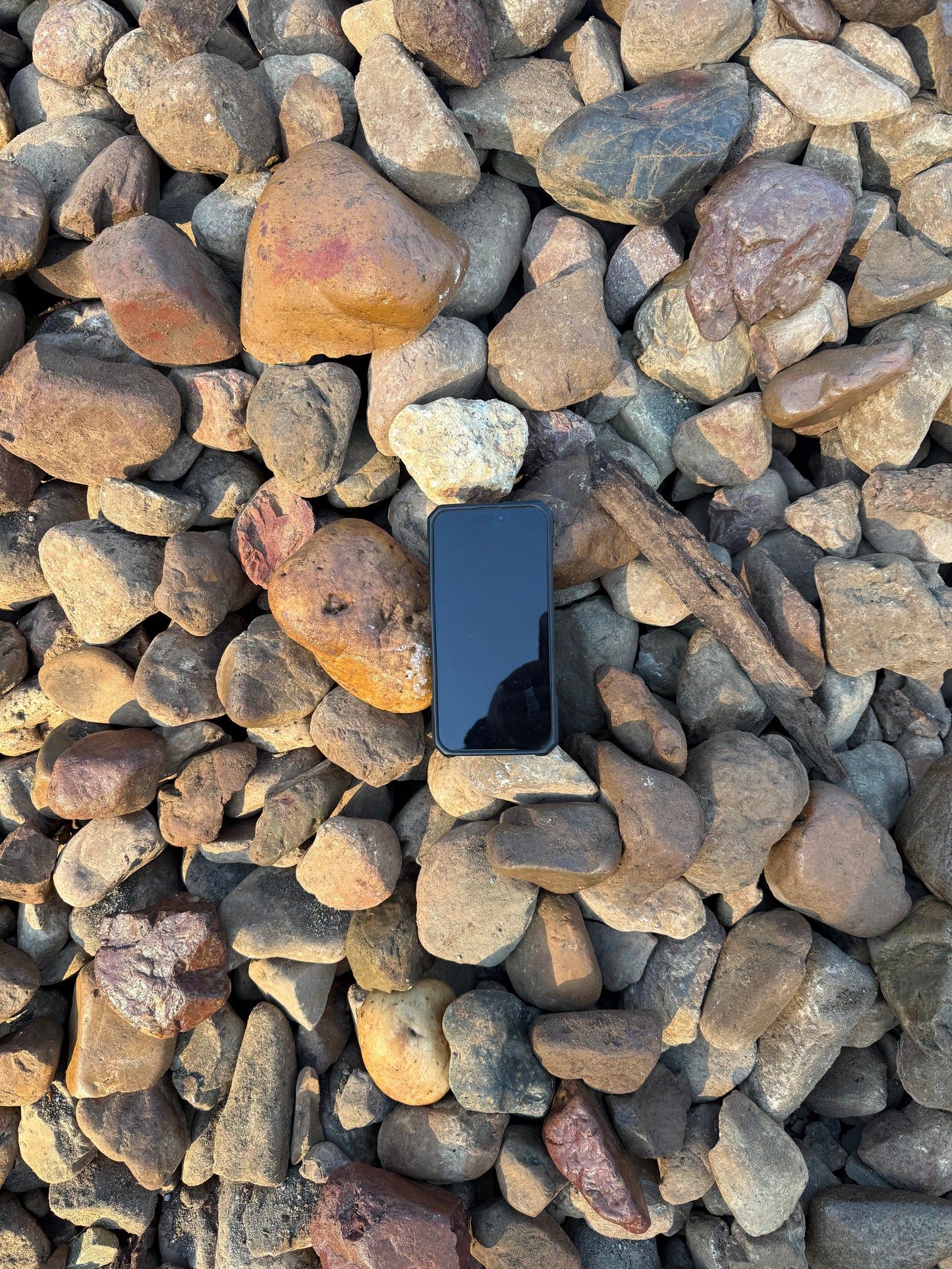 75-150mm Mary River Pebble close-up showing warm earthy tones, rounded stones for dry creek beds and garden features QLD