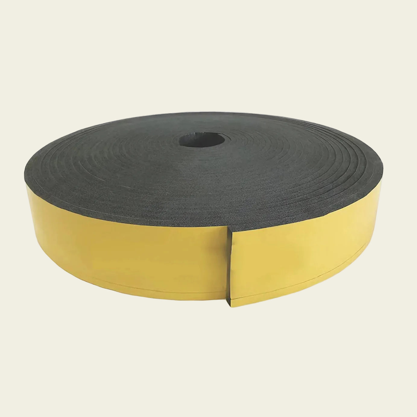 Roll of black foam tape with yellow backing on a white background