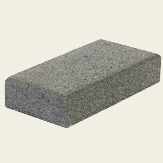 Rectangular gray concrete block on a white background