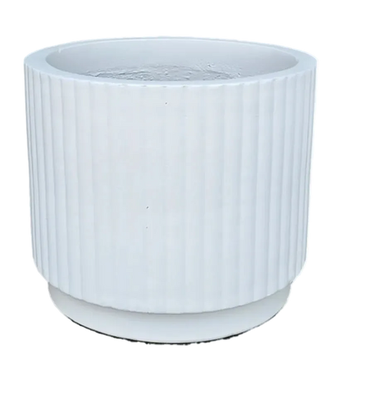 Ceramic vase with textured surface on a white background