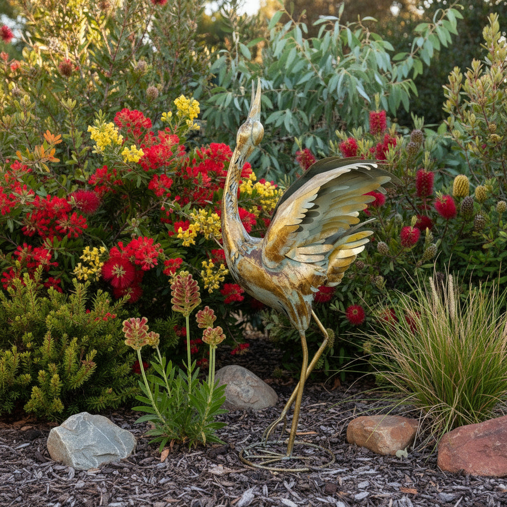 Gold bird sculpture in a native garden