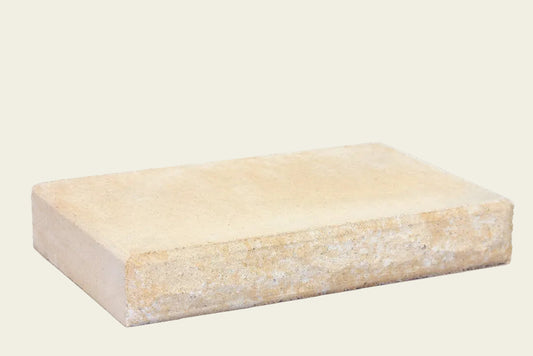 Rectangular beige stone block on a white background